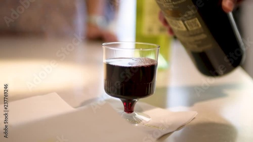 Pouring Red Wine into a Glass