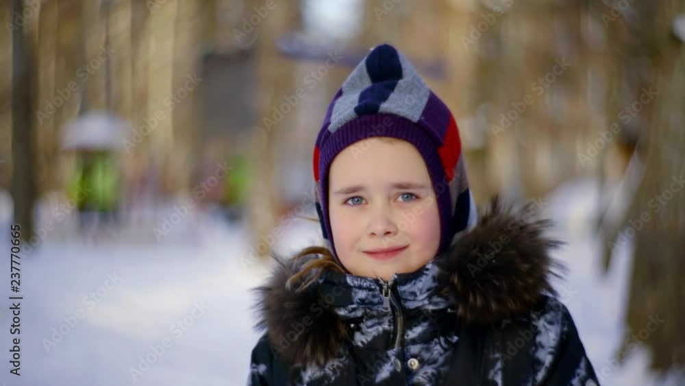 portrait of a cute girl in winter coat with cap hat portrait of a cute girl in winter coat with cap hat