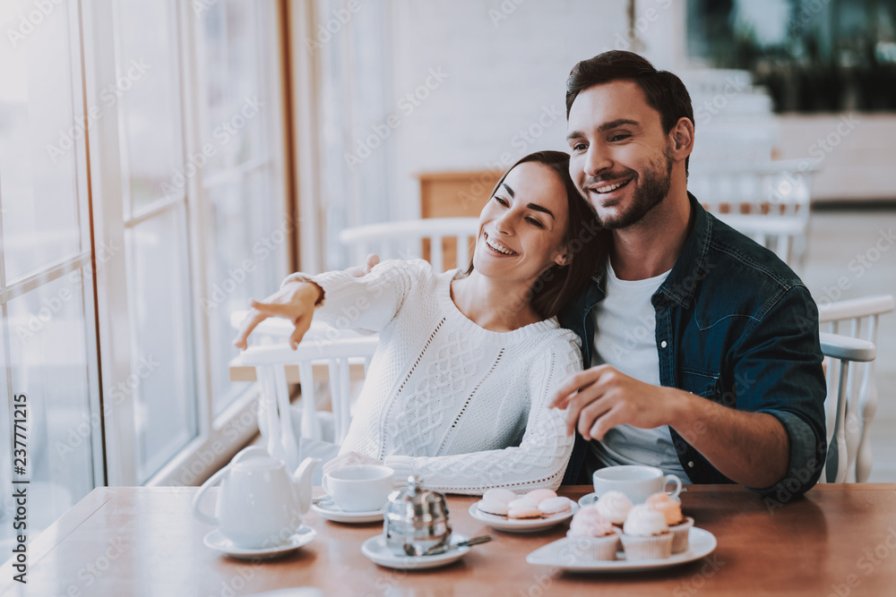 Young Couple is Resting in Cafe