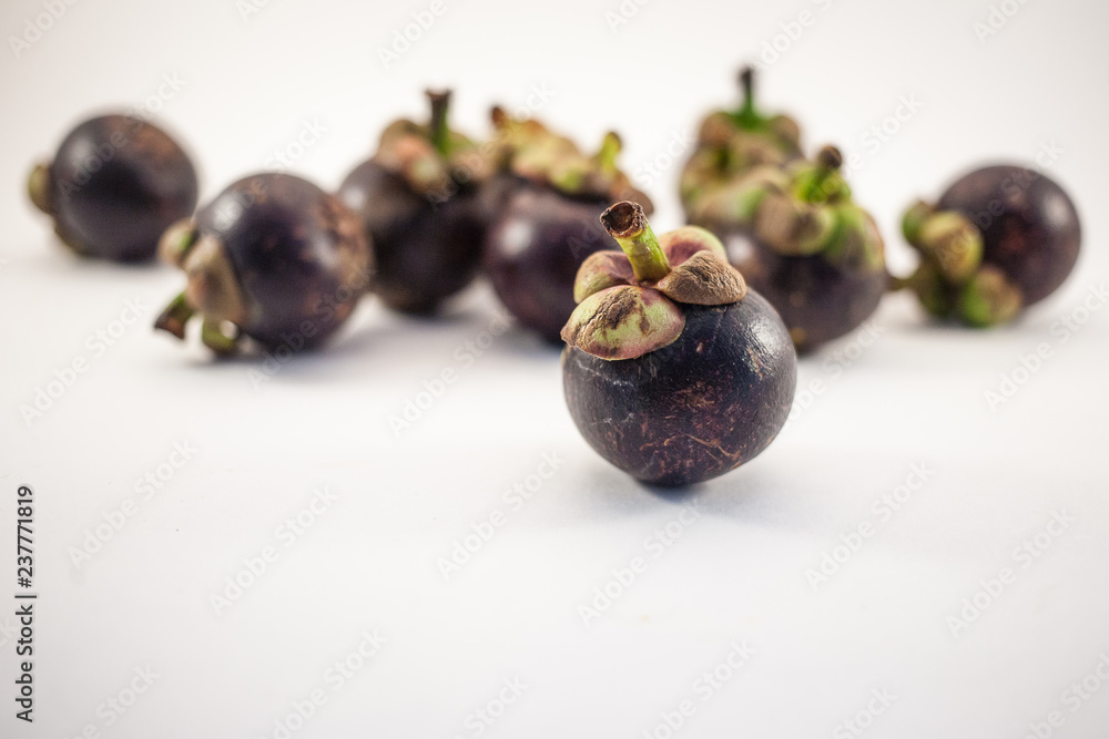 Mangosteens isolated on white background Mangosteens isolated on white background