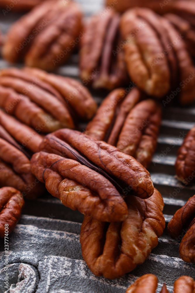 delicious pecan nuts on a rustic wooden background delicious pecan nuts on a rustic wooden background