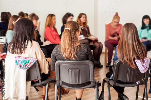Group of young women talking sitting in a circle. Psychological support