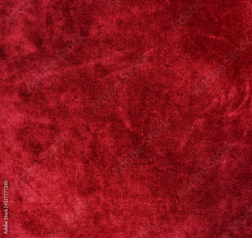 velvet texture background red color. Christmas festive baskground. expensive luxury, fabric, material, cloth.Copy space. photo