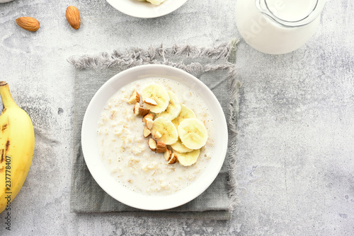 Oats porridge with banana slices and nuts