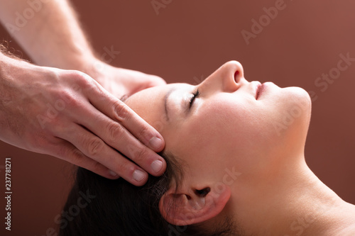 Therapist Massaging Woman's Head