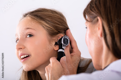 Doctor Checking Girl's Ear