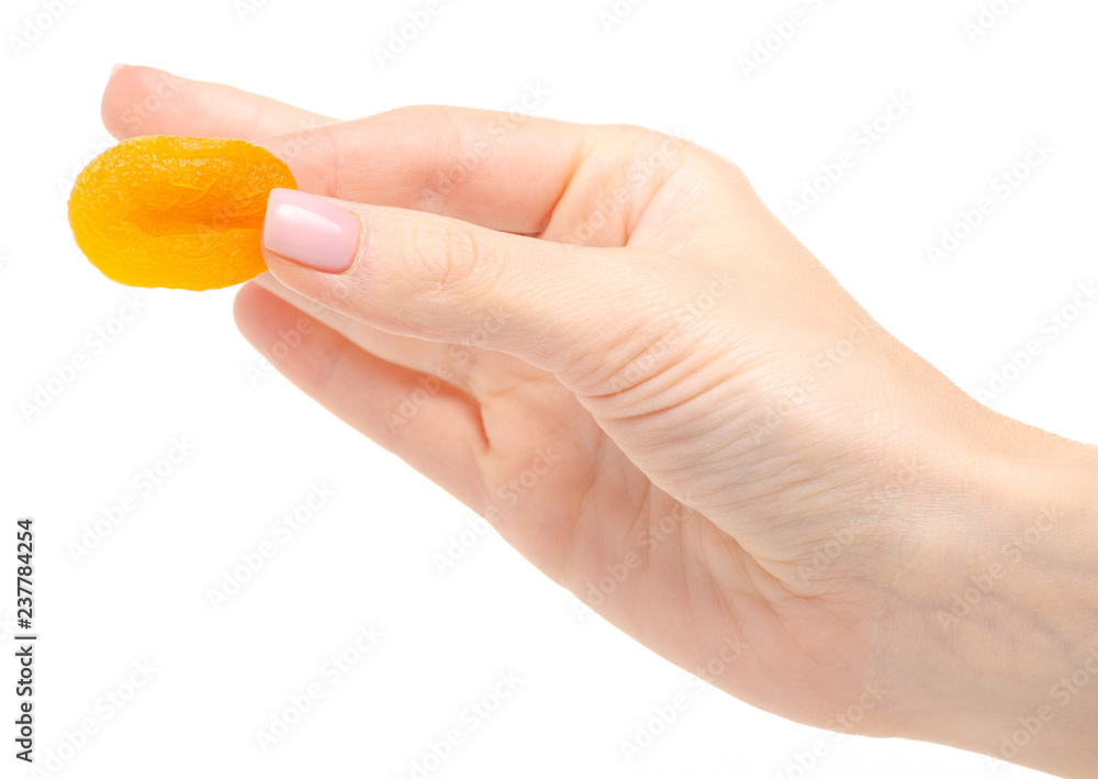 Dried apricots in hand on white background isolation Dried apricots in hand on white background isolation