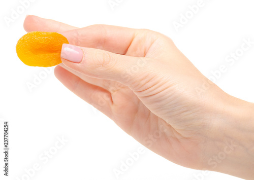 Dried apricots in hand on white background isolation
