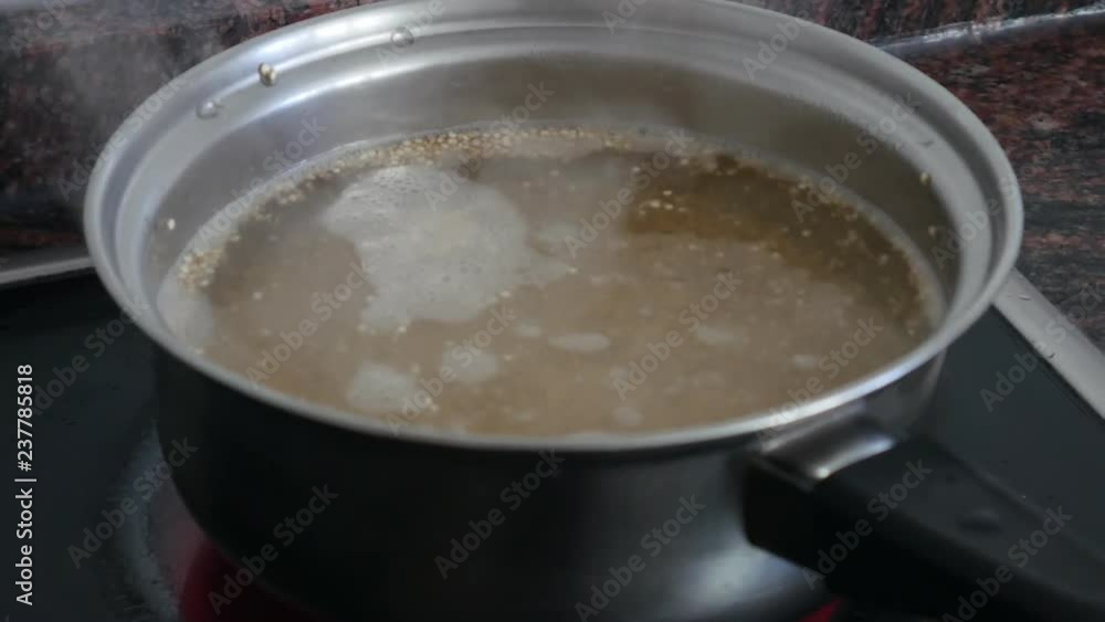 Boiling quinoa in a pan, cooking quinua, quinoa recipe Boiling quinoa in a pan, cooking quinua, quinoa recipe