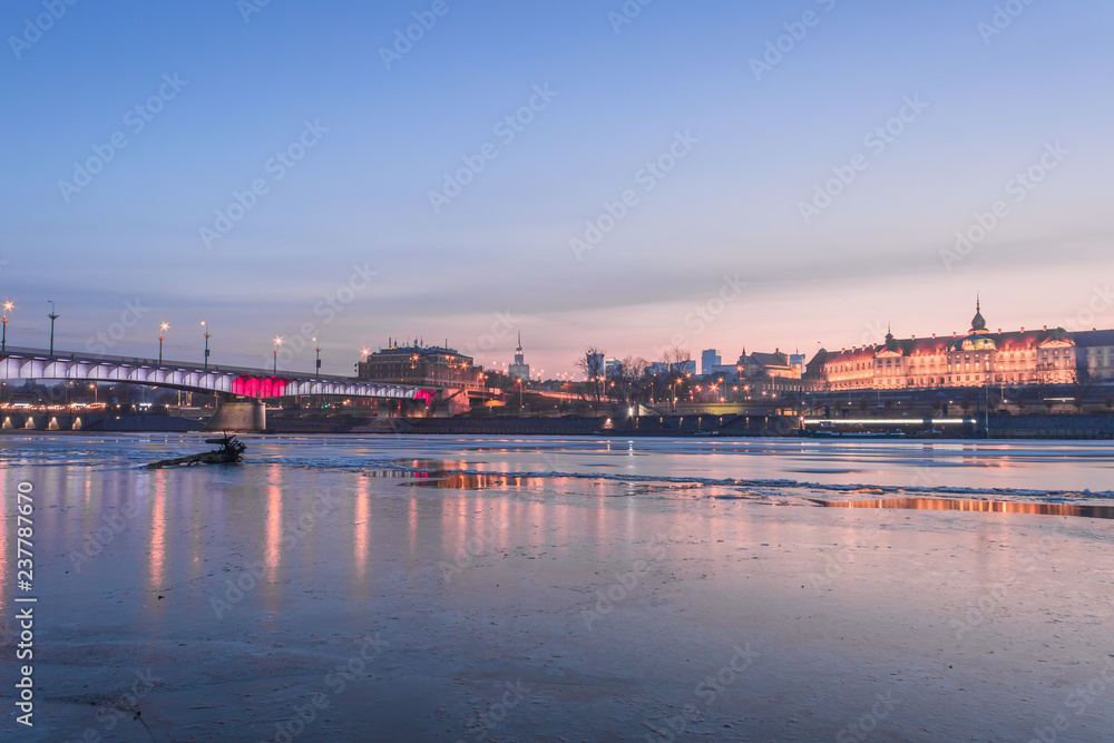 Warsaw skyline with reflection in the Vistula river at the evening