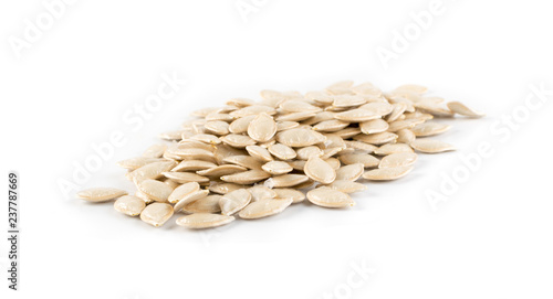 Squash, pumpkin or melon seeds isolated on white background