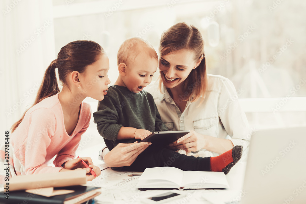 A Woman Works During Maternity Leave At Home. A Woman Works During Maternity Leave At Home.