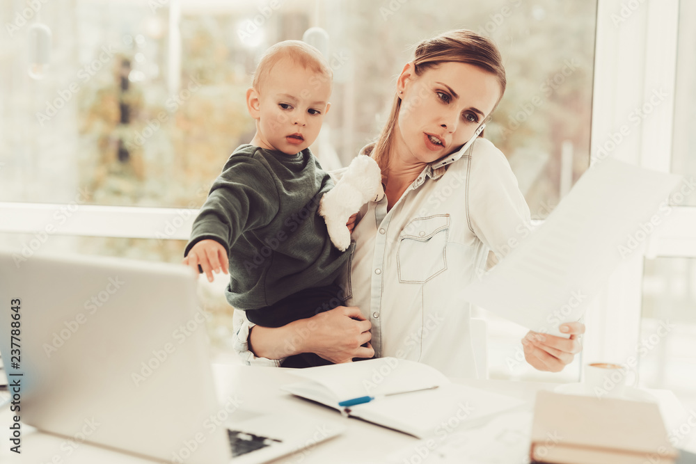 A Woman Works During Maternity Leave At Home. A Woman Works During Maternity Leave At Home.