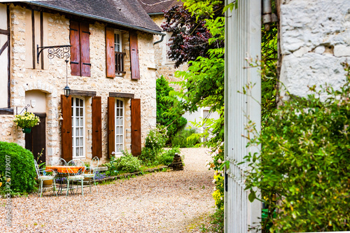 Quaint French farmhouse and garden © Dusseauphoto