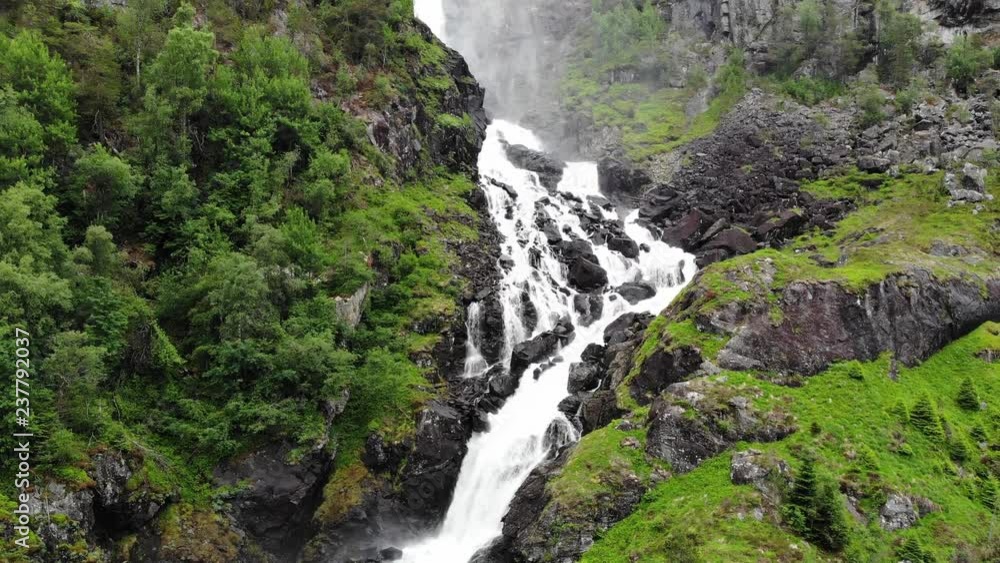 Aerial view. Norwegian landscape. Twin waterfall Latefoss or Latefossen in summertime, Odda Hordaland County in Norway. National tourist Hardanger road 13 Aerial view. Norwegian landscape. Twin waterfall Latefoss or Latefossen in summertime, Odda Hordaland County in Norway. National tourist Hardanger road 13