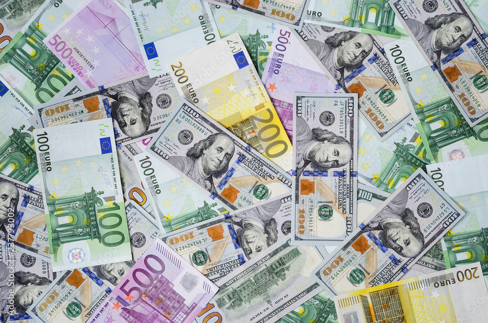 euro banknotes and dollars randomly laid out 5