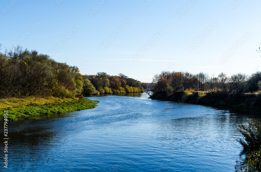 The river channel turns beyond the forest. Autumn is a typical type of floodplain The river channel turns beyond the forest. Autumn is a typical type of floodplain