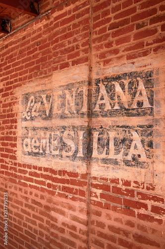 La Ventana de Mesilla painted sign on a brick wall in Las Cruces NM photo