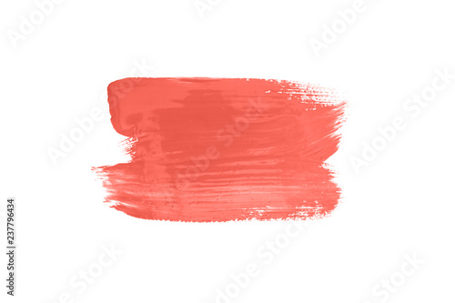 Living coral color abstract brush stroke isolated on white.