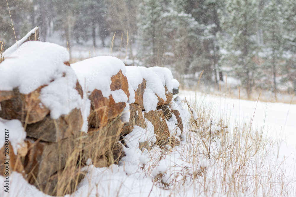 Small landscaped rock wall with snow Small landscaped rock wall with snow