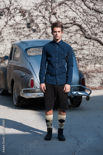 Male model with vintage old car