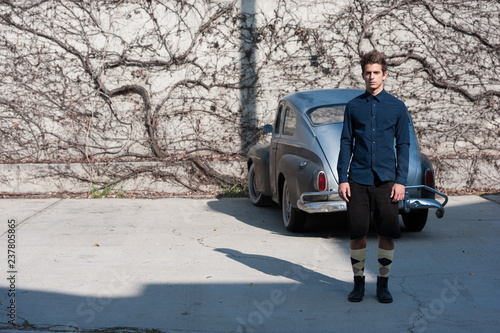 Male model with vintage old car