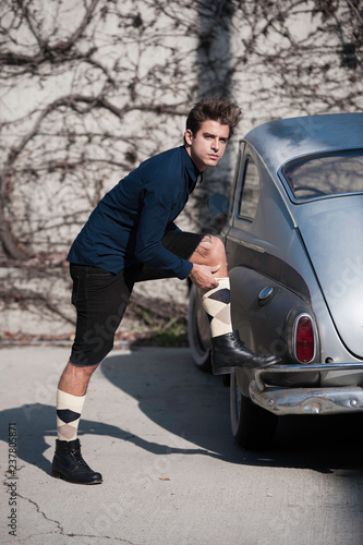 Male model with vintage car