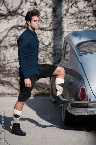 Male model with vintage car