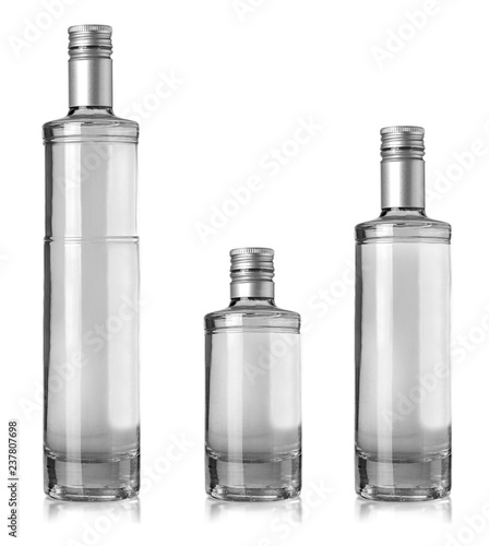 The Beautiful Clear Bottles with clear liquid on white