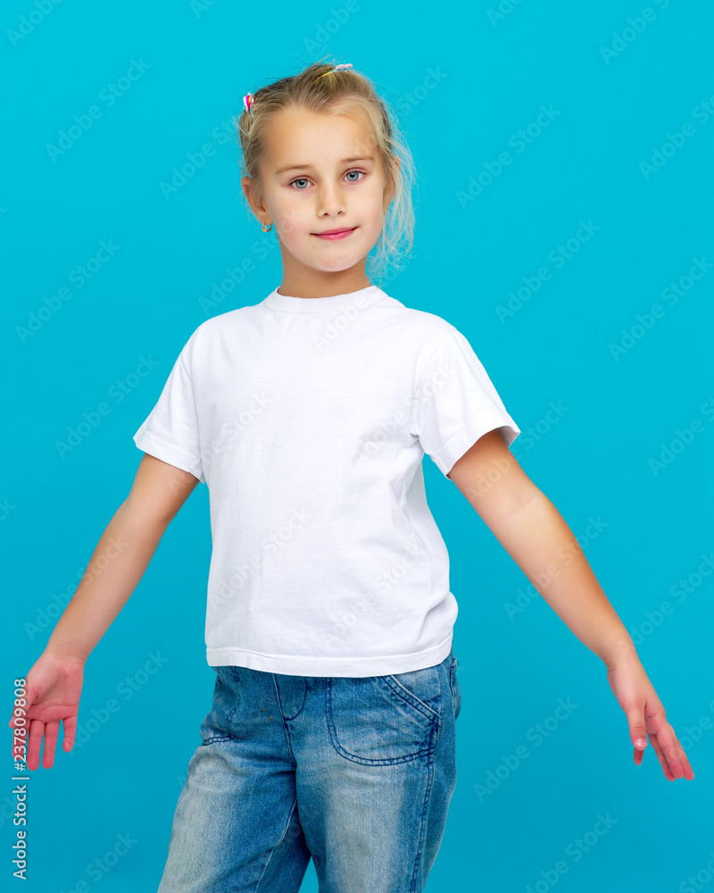 Emotional little girl in a clean white T-shirt. Emotional little girl in a clean white T-shirt.