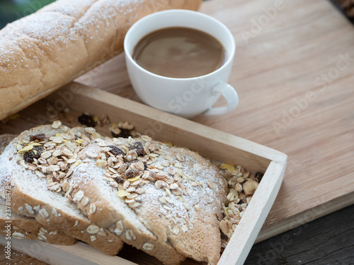 Breakfast served with glass of coffee and bread on the wood table. Health breakfast