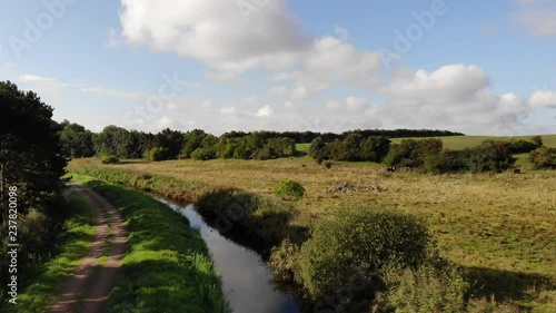 Aerial view of fields with watercourse close to Sejer√∏bugten in Odsherred. photo