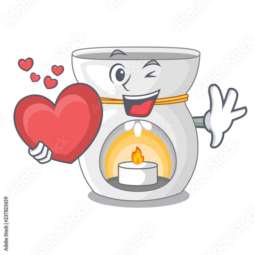With heart aroma lamp with burning candle mascot