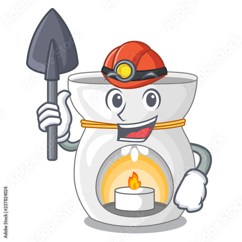 Miner aroma lamp with burning candle mascot
