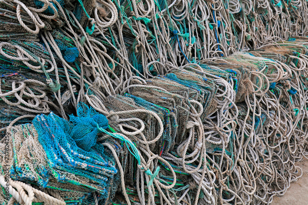 Marine fishing nets stacked together Marine fishing nets stacked together