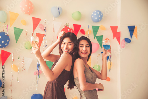 Photography party time of beautiful women in evening dress drinking alcohol champagne celebr