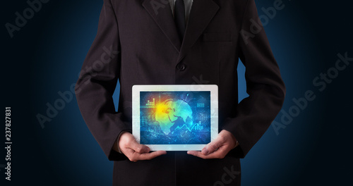 Wallpaper Mural Hand holding tablet with global database concept
 Torontodigital.ca