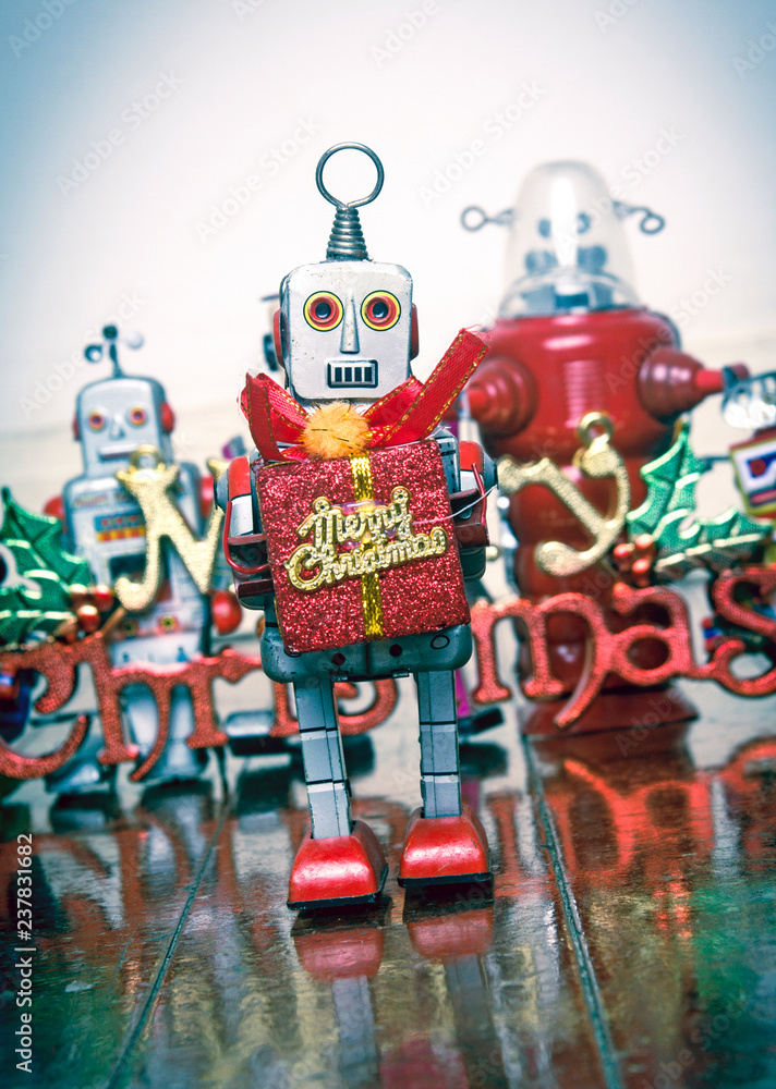 retro robots  with gifts on a old wooden floor