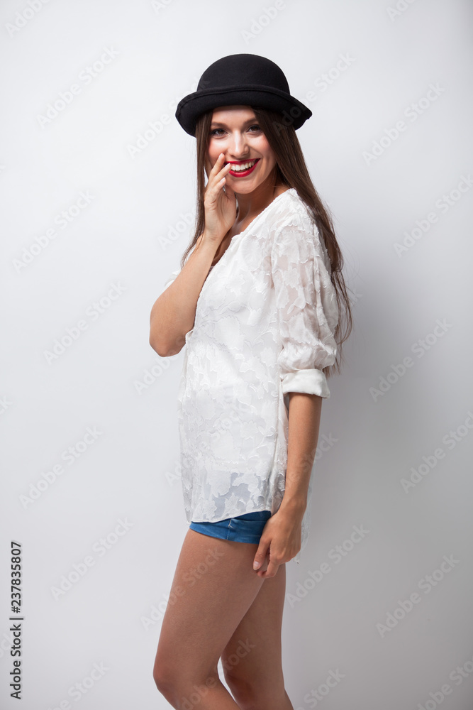 Excited young casual girl having fun. Isolated on white background Excited young casual girl having fun. Isolated on white background