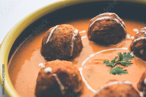 Malai Kofta Curry is a Mughlai special recipe served in a bowl. Selective focus photo