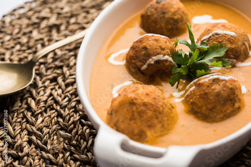 Malai Kofta Curry is a Mughlai special recipe served in a bowl. Selective focus photo