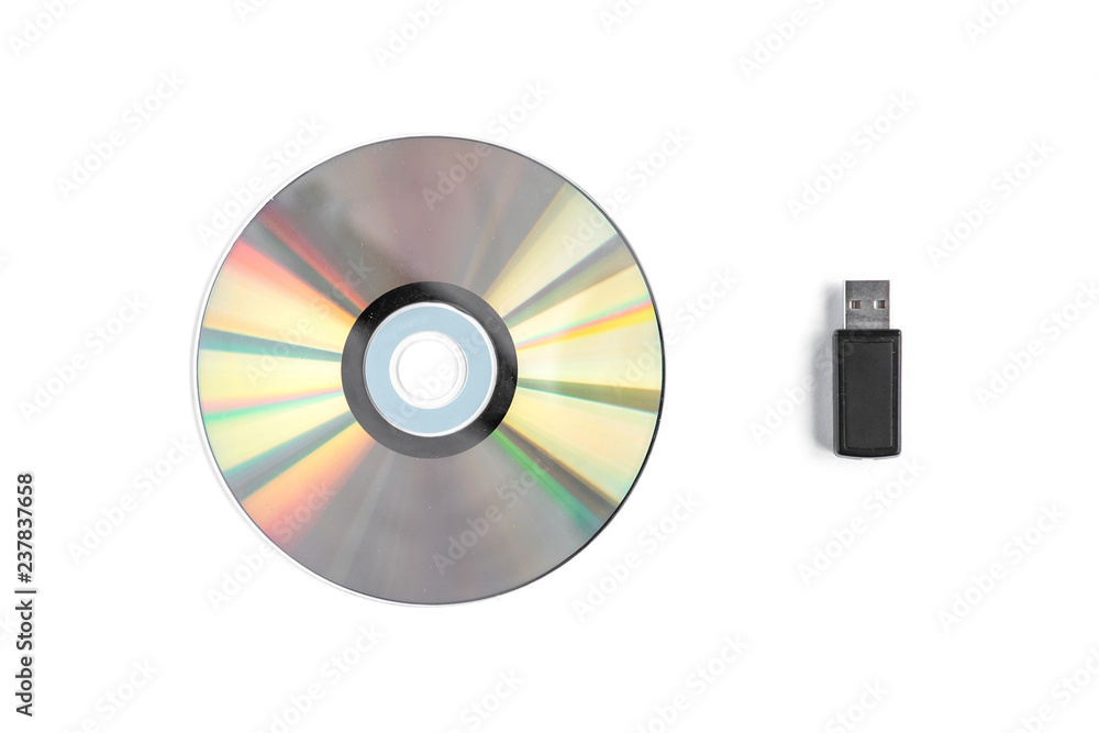 CD disc and USB flash isolated on white background. CD disc and USB flash isolated on white background.