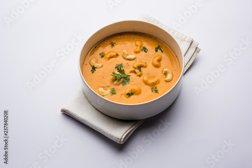 Cashew Curry / Indian kaju masala served in a bowl or pan. selective focus photo