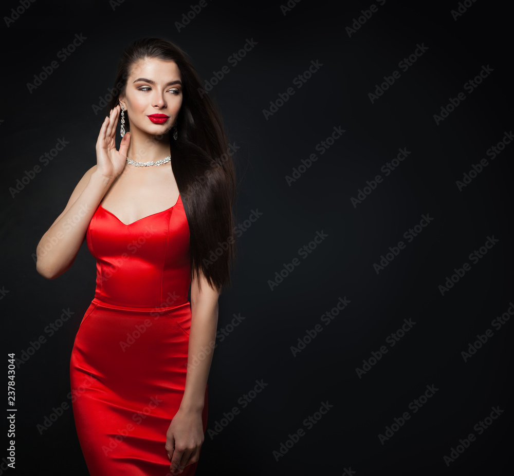 Glamorous woman wearing red dress. Sexy model with red lips makeup and  diamond jewelry on black background with copy space Stock Photo | Adobe  Stock