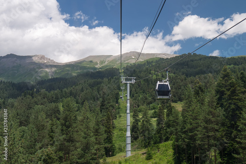the view of the Caucasus mountains through the cable car cabin window