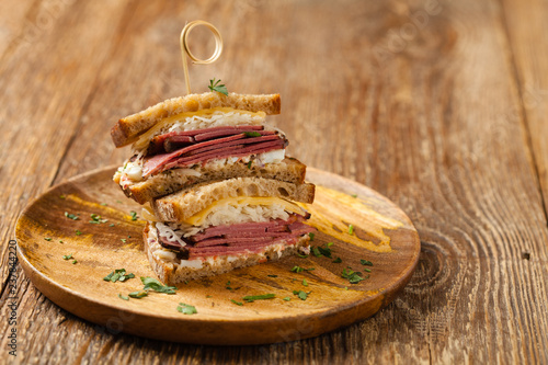 Ruben sandwich. New York sandwich with pastrami, sauce 1000 islands and sauerkraut.