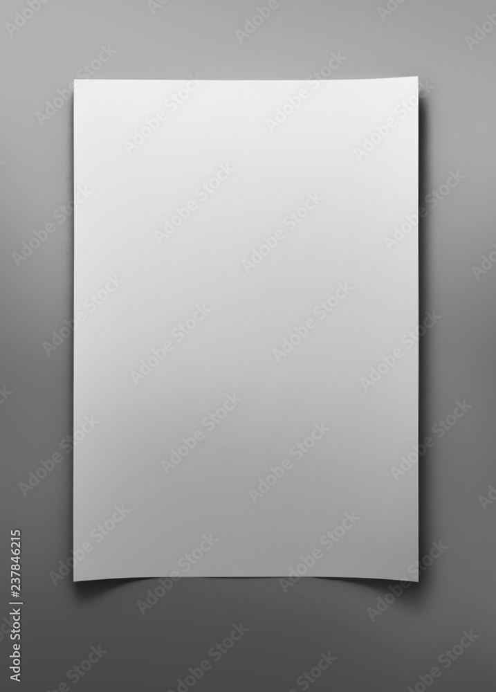 Blank sheet of white paper on gray background with clipping path Blank sheet of white paper on gray background with clipping path