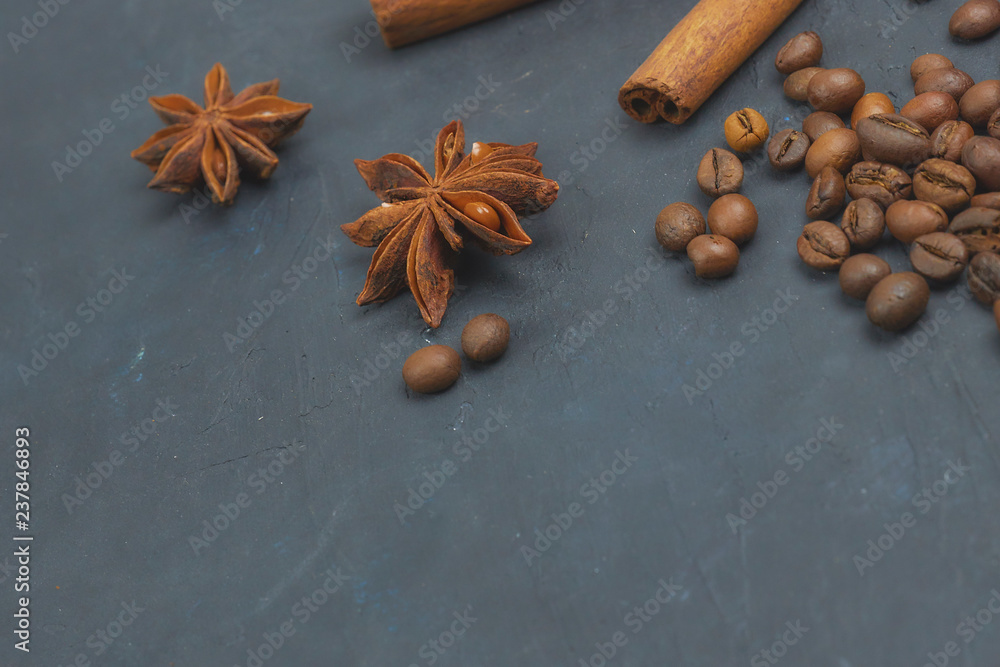 roasted coffee beans scattering in the corner of the background. beans on a dark background. view from above. copy space. roasted coffee beans scattering in the corner of the background. beans on a dark background. view from above. copy space.
