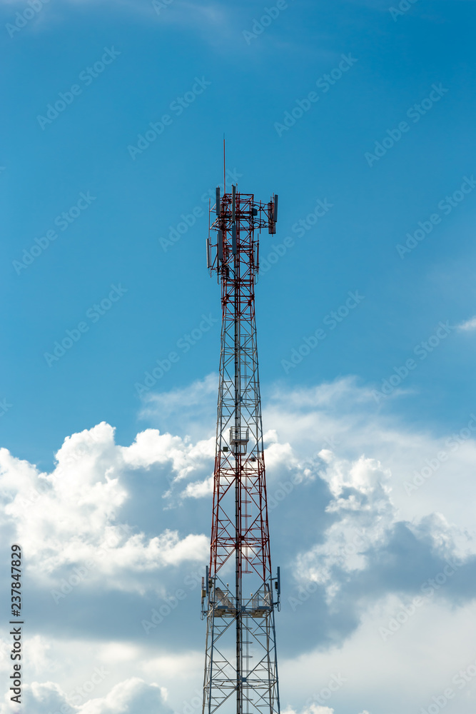 Antenna repeater tower on blue sky.