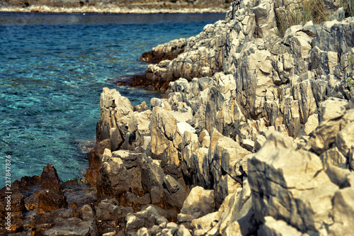 sharp rocks on the coast of Croatia. Dalmatia in the summer. Close up with shallow depth of field. © ultrapro